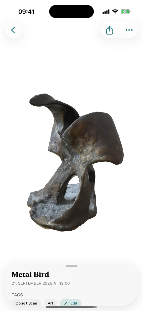 A photoreal 3D scan of a metal bird sculpture